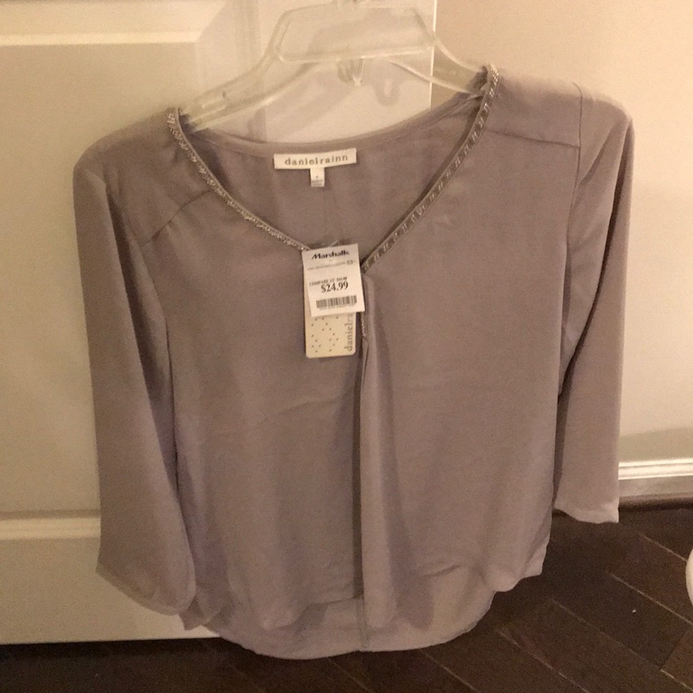 Beige/tan/grayish blouse with beaded neckline